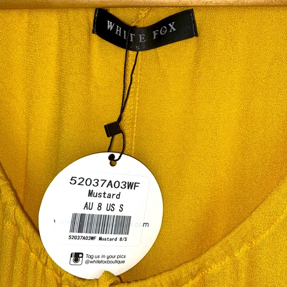 White Fox Boutique Marigold Yellow Tassel Tie Ruffle Romper Jumper - Picture 9 of 15